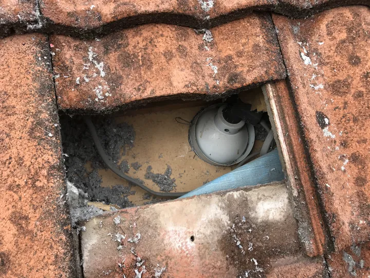 Customer photo: a recessed downlight in the roof cavity that needs capping before we pump.